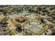 Aerial view of multiple outdoor tennis courts, surrounded by lush trees at 7 Appaloosa Trl, Ormond Beach, FL 32174