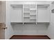 Organized walk-in closet featuring built-in shelves and rods for ample storage at 7 Appaloosa Trl, Ormond Beach, FL 32174
