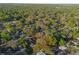 Lovely aerial view of a home with beautiful mature trees in a quiet neighborhood at 782 Valencia Ave, Orange City, FL 32763