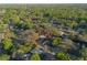 Beautiful aerial view of a home surrounded by lush greenery and mature trees at 782 Valencia Ave, Orange City, FL 32763