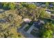Aerial view of the home showcasing mature trees on a serene residential street at 782 Valencia Ave, Orange City, FL 32763