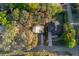 Charming aerial view of two homes and their yards surrounded by trees at 782 Valencia Ave, Orange City, FL 32763