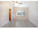 Well-lit bedroom featuring a ceiling fan, neutral walls, and natural light from the window at 782 Valencia Ave, Orange City, FL 32763