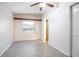 The bright bedroom features speckled floors, a large window, and ample natural light at 782 Valencia Ave, Orange City, FL 32763