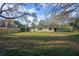 A charming home with mature trees surrounding the property offers a serene outdoor space at 782 Valencia Ave, Orange City, FL 32763