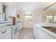 Kitchen with new countertops, white cabinets, and modern appliances at 782 Valencia Ave, Orange City, FL 32763