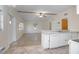 Bright, open living space featuring a ceiling fan and view of the kitchen area at 782 Valencia Ave, Orange City, FL 32763