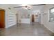Spacious living area with open floor plan, built-in shelves, and kitchen view at 782 Valencia Ave, Orange City, FL 32763