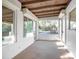 Enclosed patio with large windows, white block walls, wood ceilings, and carpeted floors at 782 Valencia Ave, Orange City, FL 32763
