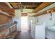 The laundry room shows a washer, dryer, utility sink, workspace, and access to the patio at 782 Valencia Ave, Orange City, FL 32763