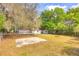 Spacious backyard featuring a patio slab and fire pit, perfect for outdoor entertaining and relaxation at 816 Overhill Rd, Deland, FL 32720