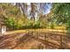 Expansive backyard with mature trees and fenced area, offering privacy and space for recreation at 816 Overhill Rd, Deland, FL 32720