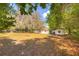 Lush backyard with mature trees creating a serene setting, ideal for relaxation and enjoying outdoor living at 816 Overhill Rd, Deland, FL 32720