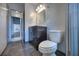 Bright bathroom featuring modern vanity, toilet, mirror and glass shower at 816 Overhill Rd, Deland, FL 32720