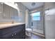 Bathroom featuring modern vanity, toilet and glass shower with tiled walls at 816 Overhill Rd, Deland, FL 32720