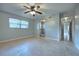 Spacious bedroom with a ceiling fan, window and ensuite bathroom access for added convenience at 816 Overhill Rd, Deland, FL 32720