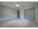 Bedroom featuring ample closet space, neutral walls and ceiling fan for a cozy retreat at 816 Overhill Rd, Deland, FL 32720