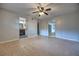 Bedroom featuring neutral carpet, sliding glass doors, and ensuite bathroom at 816 Overhill Rd, Deland, FL 32720