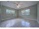 Well-lit bedroom with neutral walls and carpet flooring providing a comfortable living space at 816 Overhill Rd, Deland, FL 32720