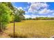 Fenced expansive land with lush greenery, ideal for outdoor activities and enjoying nature at 816 Overhill Rd, Deland, FL 32720