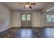 Open floor plan showcases neutral walls, ceiling fan, tile flooring, and a double door front entry at 816 Overhill Rd, Deland, FL 32720