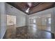 A large living room featuring a dark wood plank ceiling and a mirrored closet at 816 Overhill Rd, Deland, FL 32720
