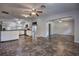 Open concept living space with tile floors that seamlessly connect living room, dining area and kitchen at 816 Overhill Rd, Deland, FL 32720