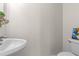 Close-up of a half-bathroom featuring a toilet and sink at 863 Riverside Dr, Ormond Beach, FL 32176