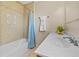 Bathroom features a tub-shower combo with tiled walls, a single vanity and decorative towels at 863 Riverside Dr, Ormond Beach, FL 32176