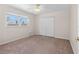 Bright bedroom with carpet, ceiling fan, and large closet at 863 Riverside Dr, Ormond Beach, FL 32176