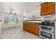 Spacious kitchen with stainless steel appliances, tile floors and abundant natural light at 863 Riverside Dr, Ormond Beach, FL 32176