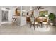 Open floor plan featuring a dining table, kitchen bar and lots of light at 863 Riverside Dr, Ormond Beach, FL 32176