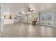 Open-concept living room features tile floors, neutral walls and ceiling fans for maximum comfort at 863 Riverside Dr, Ormond Beach, FL 32176