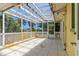 Enclosed patio with ceiling and outdoor access providing the perfect entertaining space at 863 Riverside Dr, Ormond Beach, FL 32176