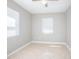 A bright, airy bedroom showcases neutral paint, tile flooring and a ceiling fan at 954 Chippendale St, Deltona, FL 32725