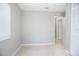 Bedroom showcasing neutral paint, tile floors, and a spacious closet at 954 Chippendale St, Deltona, FL 32725