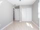 Bedroom featuring neutral paint, tile flooring, and ample closet space at 954 Chippendale St, Deltona, FL 32725