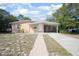 Lovely home with a covered carport, walkway, and a well-maintained front lawn at 954 Chippendale St, Deltona, FL 32725