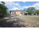 Charming single-story home featuring a covered carport and neutral stucco exterior at 954 Chippendale St, Deltona, FL 32725