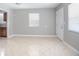 Bright room featuring neutral walls, tile floors, and a window for ample natural light at 954 Chippendale St, Deltona, FL 32725