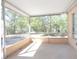 Screened in patio with tile floor and view of the yard at 954 Chippendale St, Deltona, FL 32725