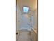 Bright bathroom featuring a skylight, shower/tub combination and single vanity at 1 Fox Hollow Dr, Ormond Beach, FL 32174