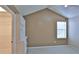 Bedroom showing built in shelving, a window with blinds and a walk in closet at 1 Fox Hollow Dr, Ormond Beach, FL 32174