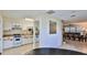 Bright eat-in kitchen features white cabinets and is adjacent to the dining area at 1 Fox Hollow Dr, Ormond Beach, FL 32174