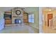 Inviting living room with stone fireplace, tile flooring, and natural light at 1 Fox Hollow Dr, Ormond Beach, FL 32174