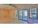 Bright living space with tile flooring, sliding doors, and ample natural light at 1 Fox Hollow Dr, Ormond Beach, FL 32174