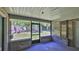 Enclosed patio with brick accents, creating a cozy outdoor space at 1 Fox Hollow Dr, Ormond Beach, FL 32174