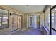 Enclosed brick patio featuring sliding door access to the home's interior at 1 Fox Hollow Dr, Ormond Beach, FL 32174
