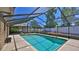 Sparkling screened-in pool with ample deck space for entertaining and relaxing at 1 Fox Hollow Dr, Ormond Beach, FL 32174