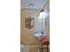 Stylish powder room with a pedestal sink, wall art and a decorative mirror at 1 Fox Hollow Dr, Ormond Beach, FL 32174